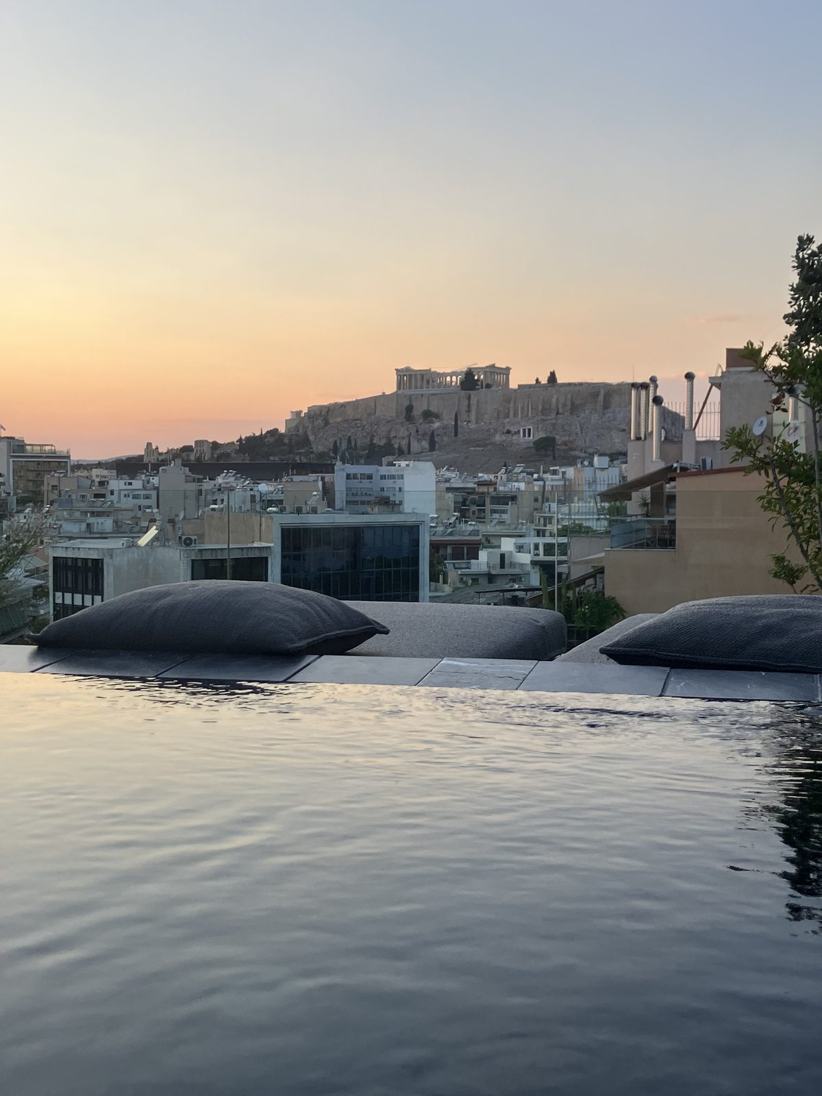 Ron and Sean in the rooftop hot tub at Monastik Hotel, Athens, with the Acropolis in view